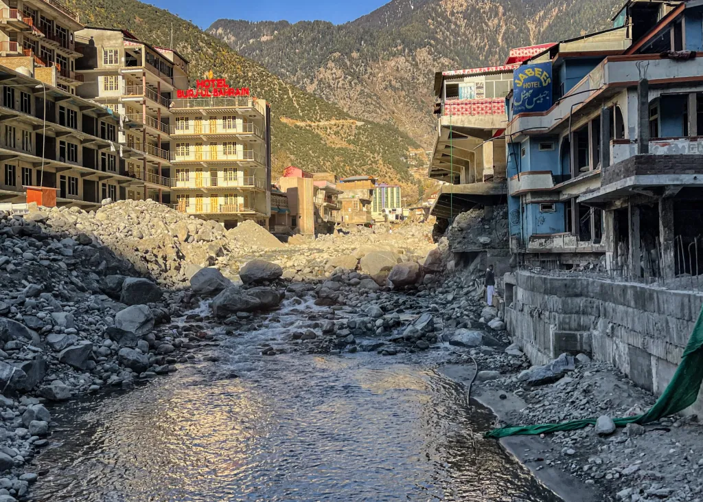 Damaged road and buildings in Bahrain, Pakistan, October 2022, in the aftermath of severe flooding. © Anita Schneider on iStock. All rights reserved.